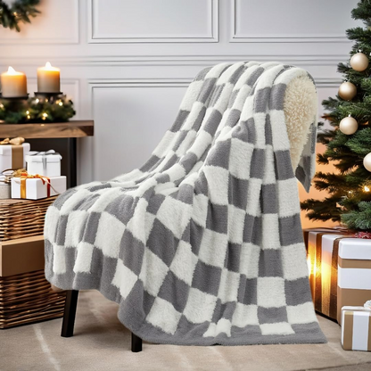 Checkered Faux Fur Feather Yarn Throw Blanket in Grey & White draped over a chair, adding a modern cozy feel. #color_Grey & White