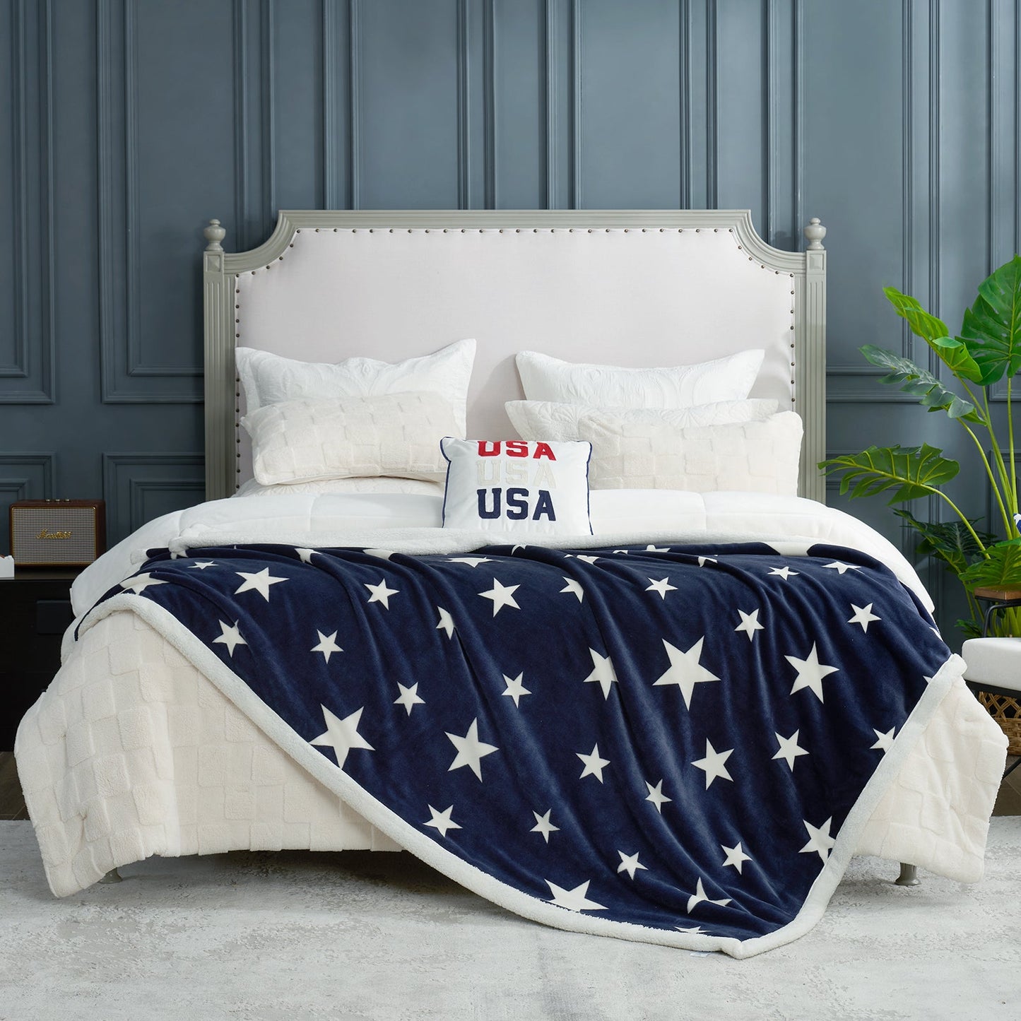 Navy blue star sherpa blanket in Navy Blue layered on a bed, creating a warm and inviting bedroom look #color_Navy Blue