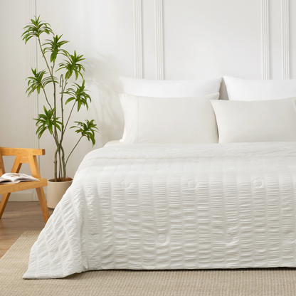 Cozy Bliss white vertical striped seersucker cooling comforter front view. #Color_Off White