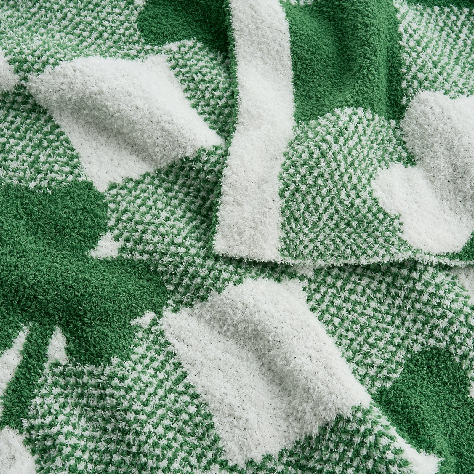 Close-up of a green and white patterned fabric with leaf designs. #color_Lucky Clover