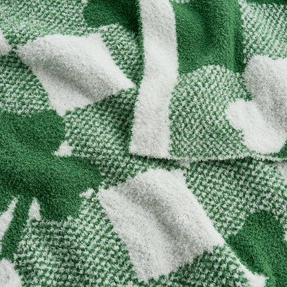 Close-up of a green and white patterned fabric with leaf designs. #color_Lucky Clover