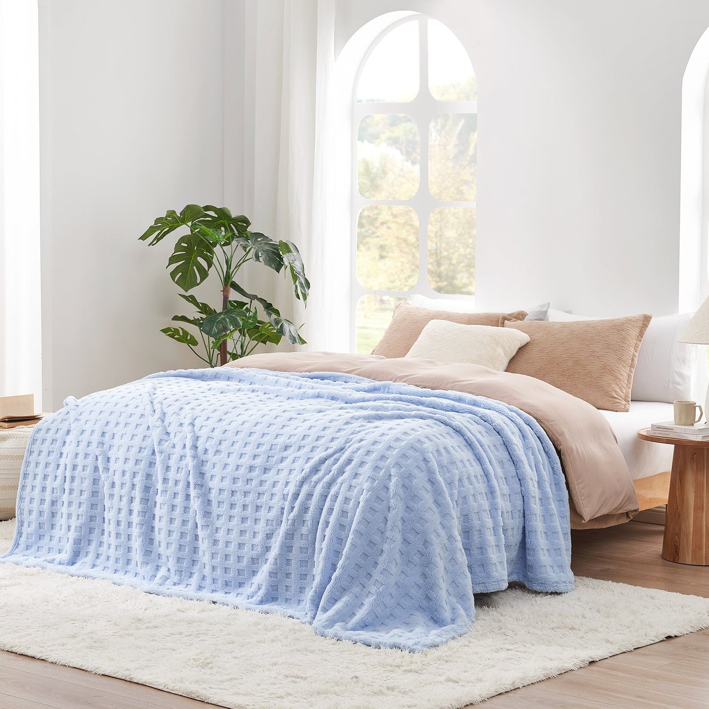 Checkered waffle shaggy sherpa throw blanket in Blue layered on a bed, creating a warm and inviting bedroom look #color_Cool Blue