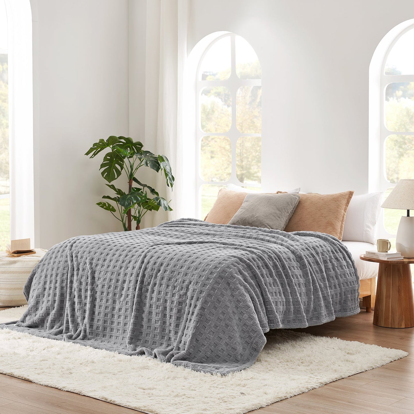 Checkered waffle shaggy sherpa throw blanket in Light Grey layered on a bed, creating a warm and inviting bedroom look #color_Grey