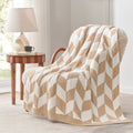 Chevron Feather Yarn Knit Throw Blanket in Beige draped over an armchair, showcasing soft feather yarn texture and chevron pattern design. #color_Beige
