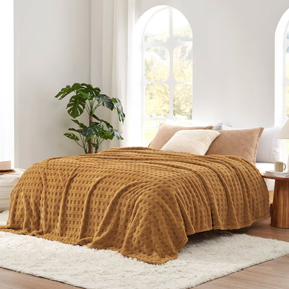 Checkered waffle shaggy sherpa throw blanket in Brown layered on a bed, creating a warm and inviting bedroom look #color_Brown