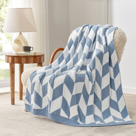 Chevron Feather Yarn Knit Throw Blanket in Blue draped over an armchair, showcasing soft feather yarn texture and chevron pattern design. #color_Blue
