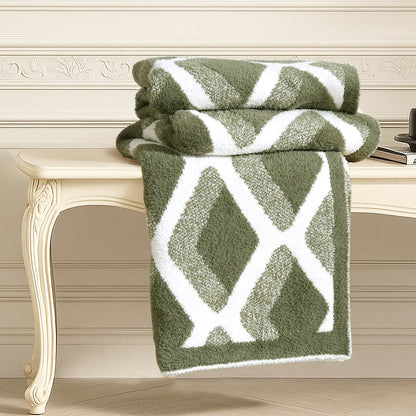 Diamond Feather Yarn Throw Blanket in Green neatly folded on a table, showcasing plush texture and detailed diamond knit design. #color_Green