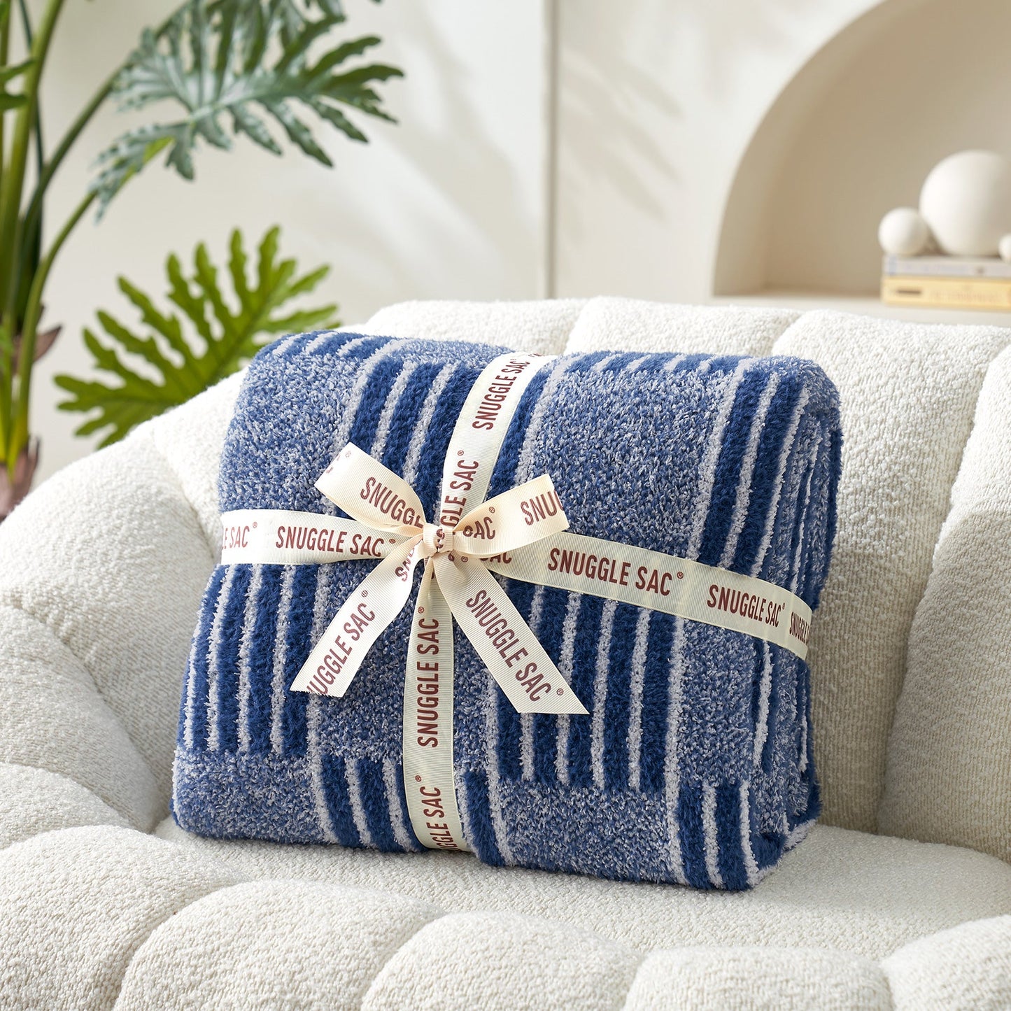 Reversible Heather Checkered Feather Yarn Throw Blanket in Navy neatly folded with ribbon, perfect as a cozy gift for holidays and special occasions. #color_Navy
