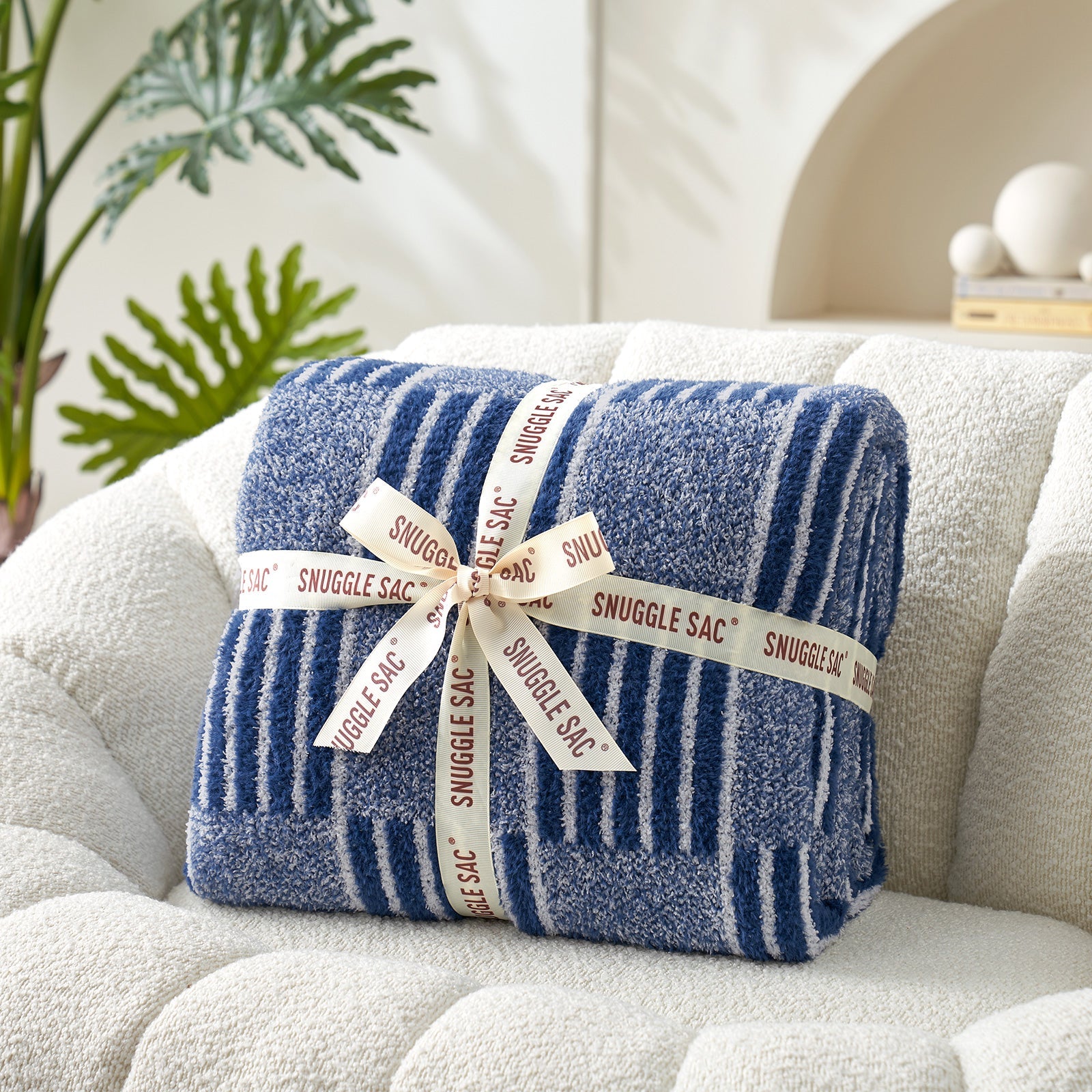 Reversible Heather Checkered Feather Yarn Throw Blanket in Navy neatly folded with ribbon, perfect as a cozy gift for holidays and special occasions. #color_Navy