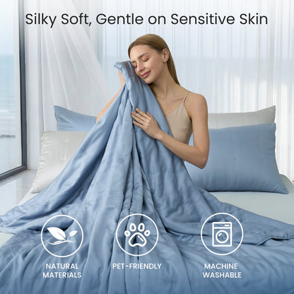 Tencel™ Lyocell cooling comforter, silky soft, skin-friendly and breathable, woman enjoying gentle comfort in bed.#Color_Dark Blue