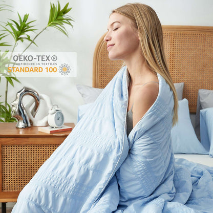 Woman wrapped in Cozy Bliss cooling comforter, OEKO-TEX certified #color_Blue