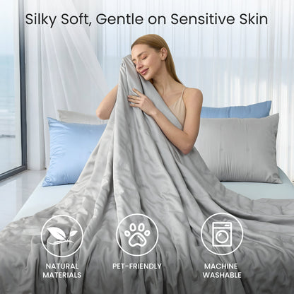 Tencel™ Lyocell cooling comforter, silky soft, skin-friendly and breathable, woman enjoying gentle comfort in bed.#Color_Grey