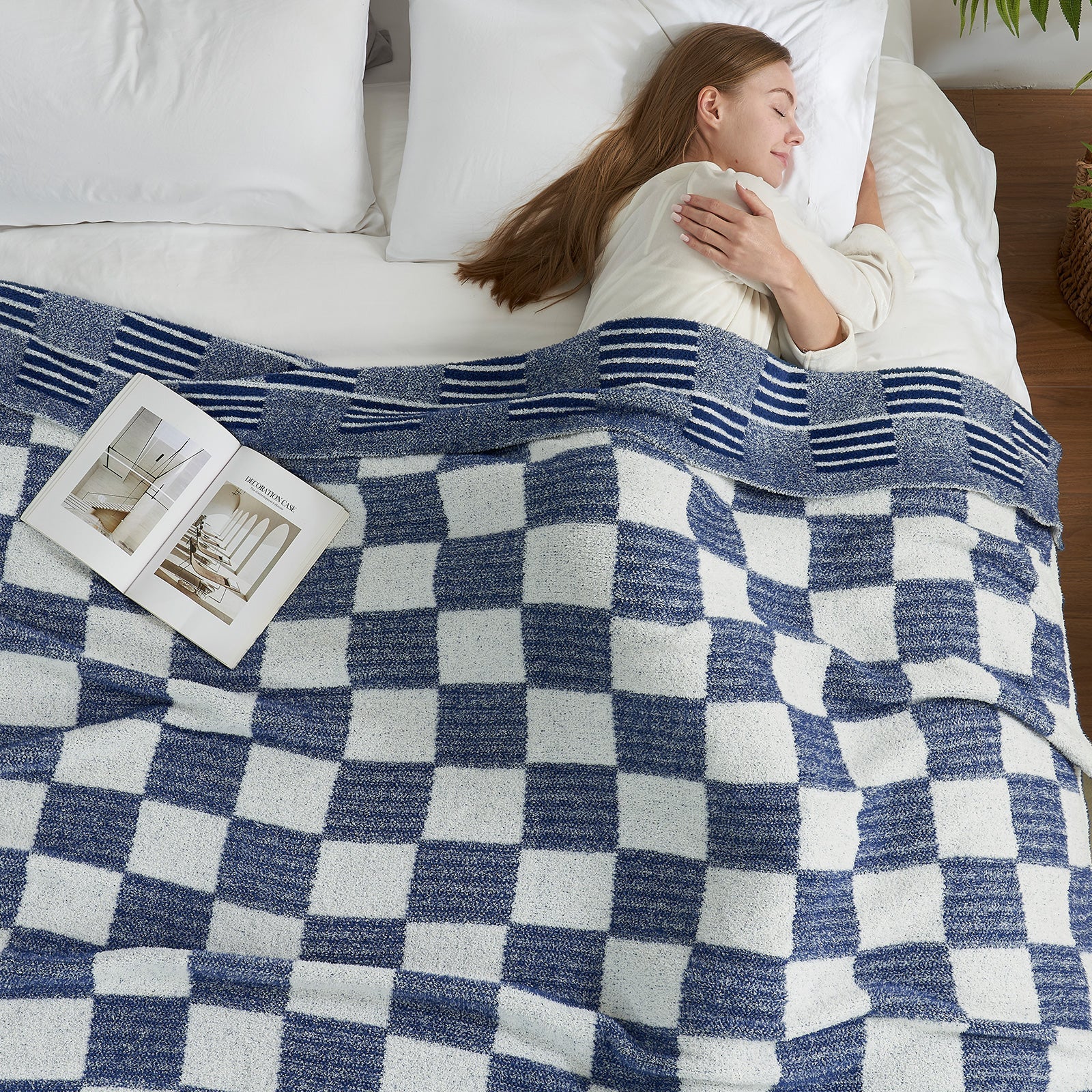 Woman sleeping under a Reversible Heather Checkered Feather Yarn Throw Blanket in Navy, offering cozy warmth and everyday comfort. #color_Navy