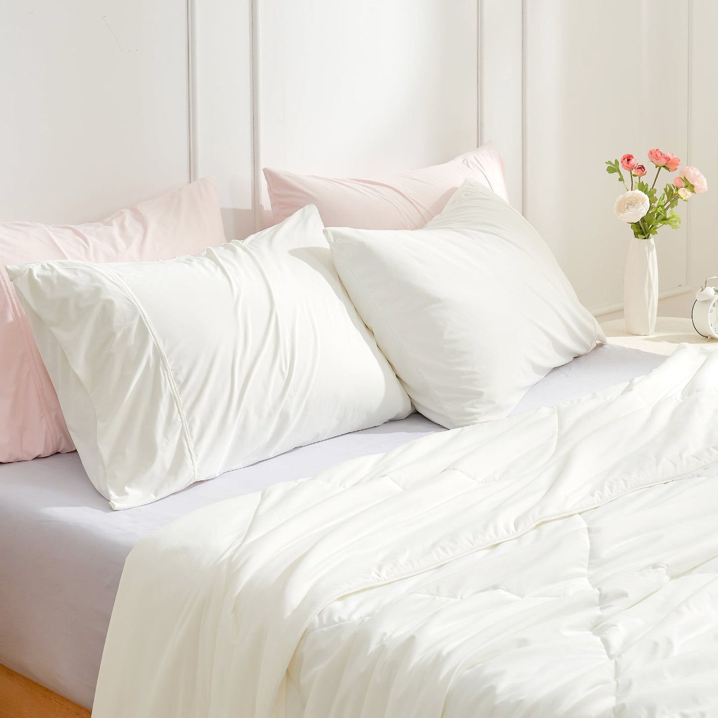 Cooling Pillowcases on bed with cozy comforter, white and pink bedding #color_Off White