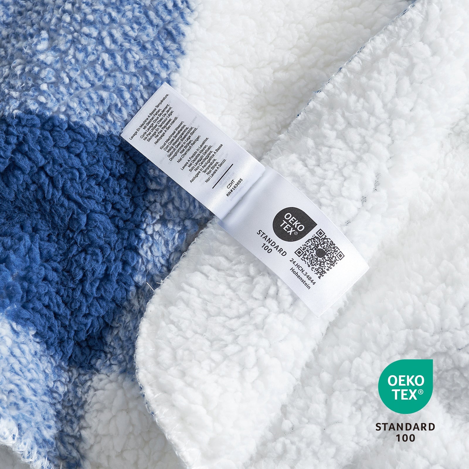 Close up of buffalo sherpa throw blanket in Buffalo Plaid-navy blue, showcasing soft sherpa texture and OEKO TEX STANDARD 100 certification #color_Buffalo Plaid-navy blue