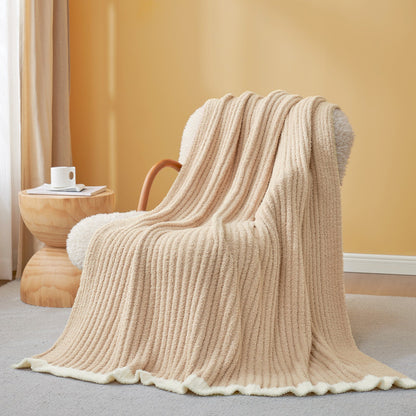 Soft Ribbed Feather Yarn Throw Blanket in Beige draped over an armchair, showcasing ribbed texture and soft feather yarn design. #Color_Beige