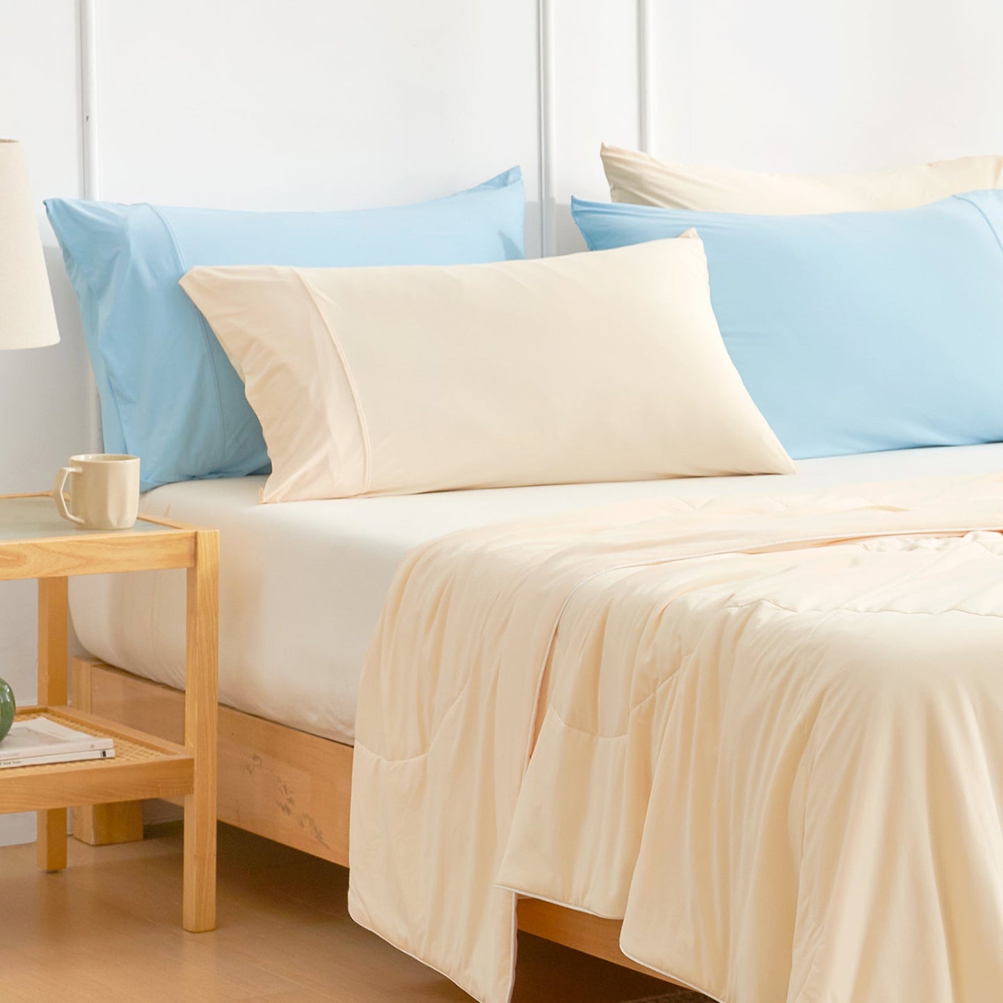 Cream Cooling Pillowcases on a bed with a matching comforter. Cozy bedding for better sleep. #color_Yellow