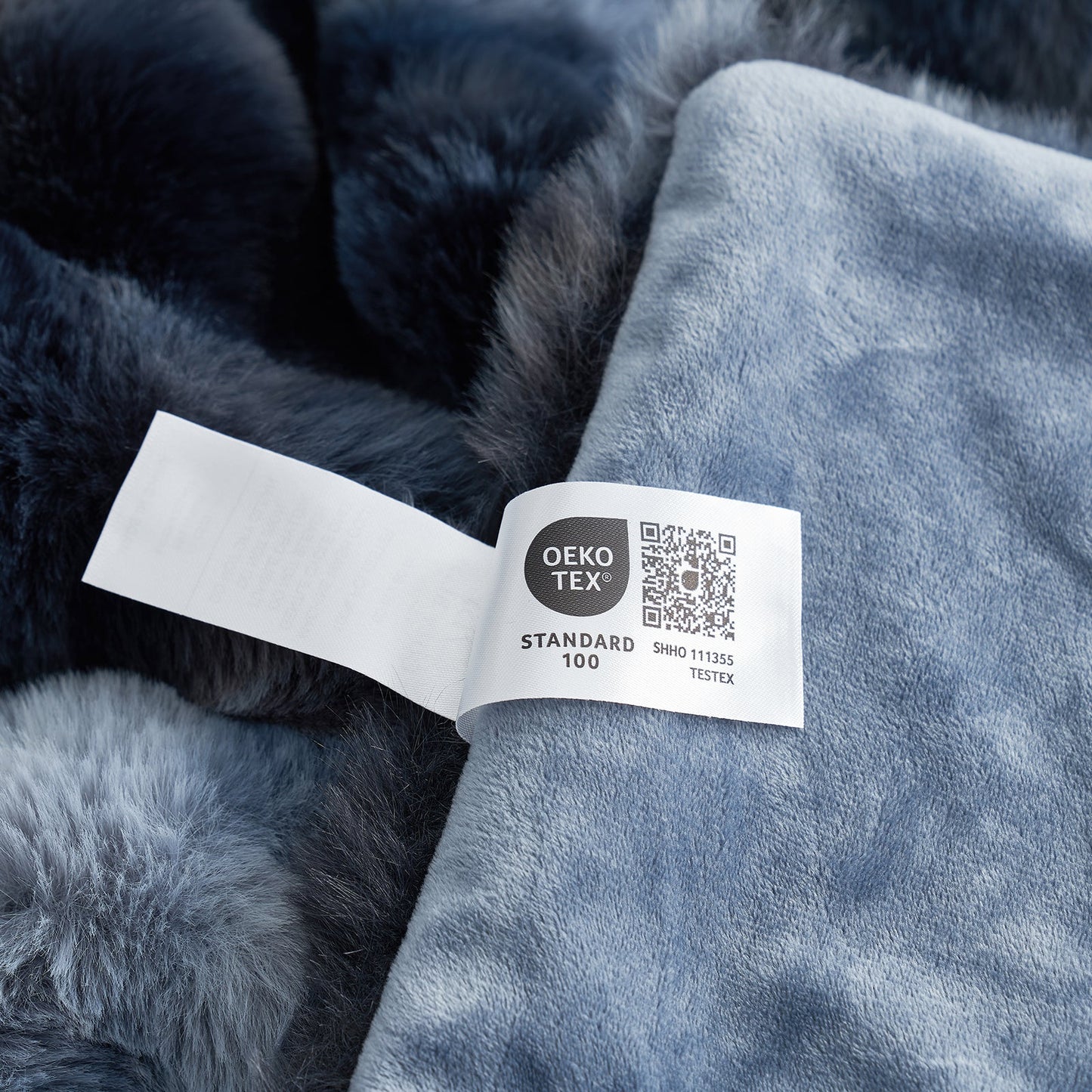 Close-up of OEKO-TEX certified faux fur tie-dye blue blanket fabric. #color_Tie-dye Blue