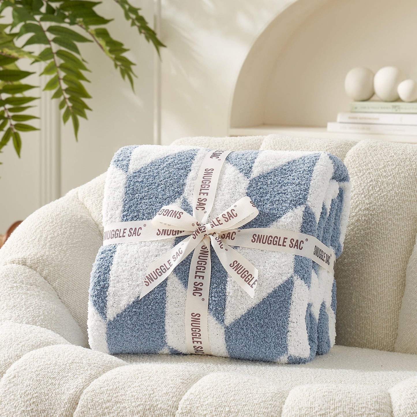 Chevron Feather Yarn Knit Throw Blanket in Blue neatly folded with ribbon packaging, perfect as a cozy gift for holidays and special occasions. #color_Blue