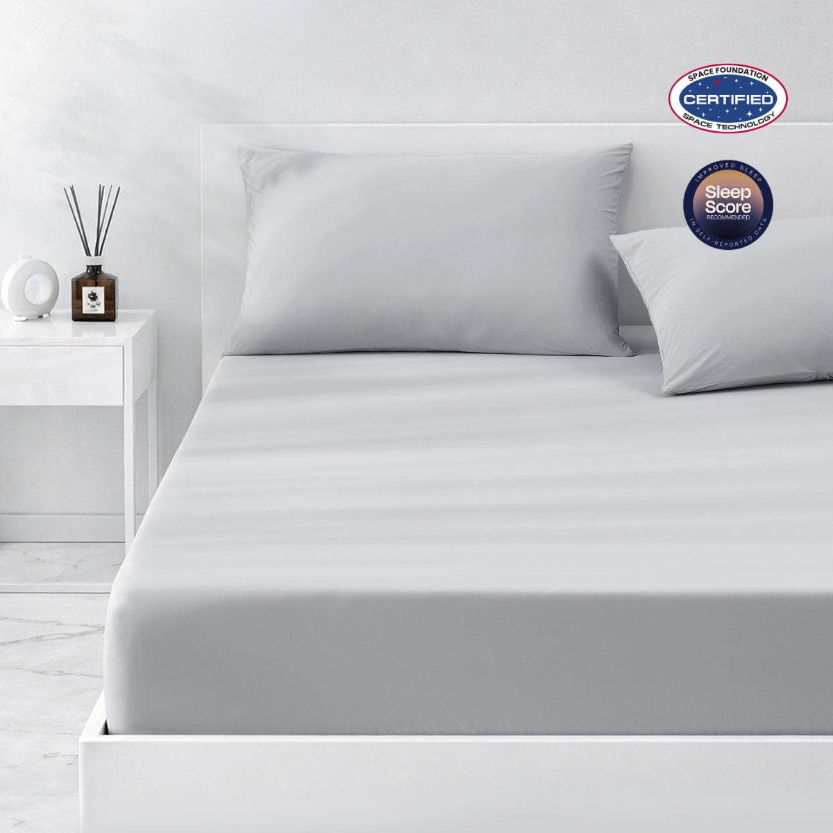 Gray cooling bedding set on a bed in a minimalistic bedroom setting.#color_Light Grey