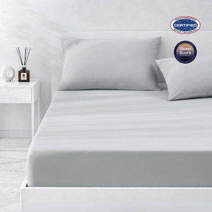 Gray cooling bedding set on a bed in a minimalistic bedroom setting.#color_Light Grey