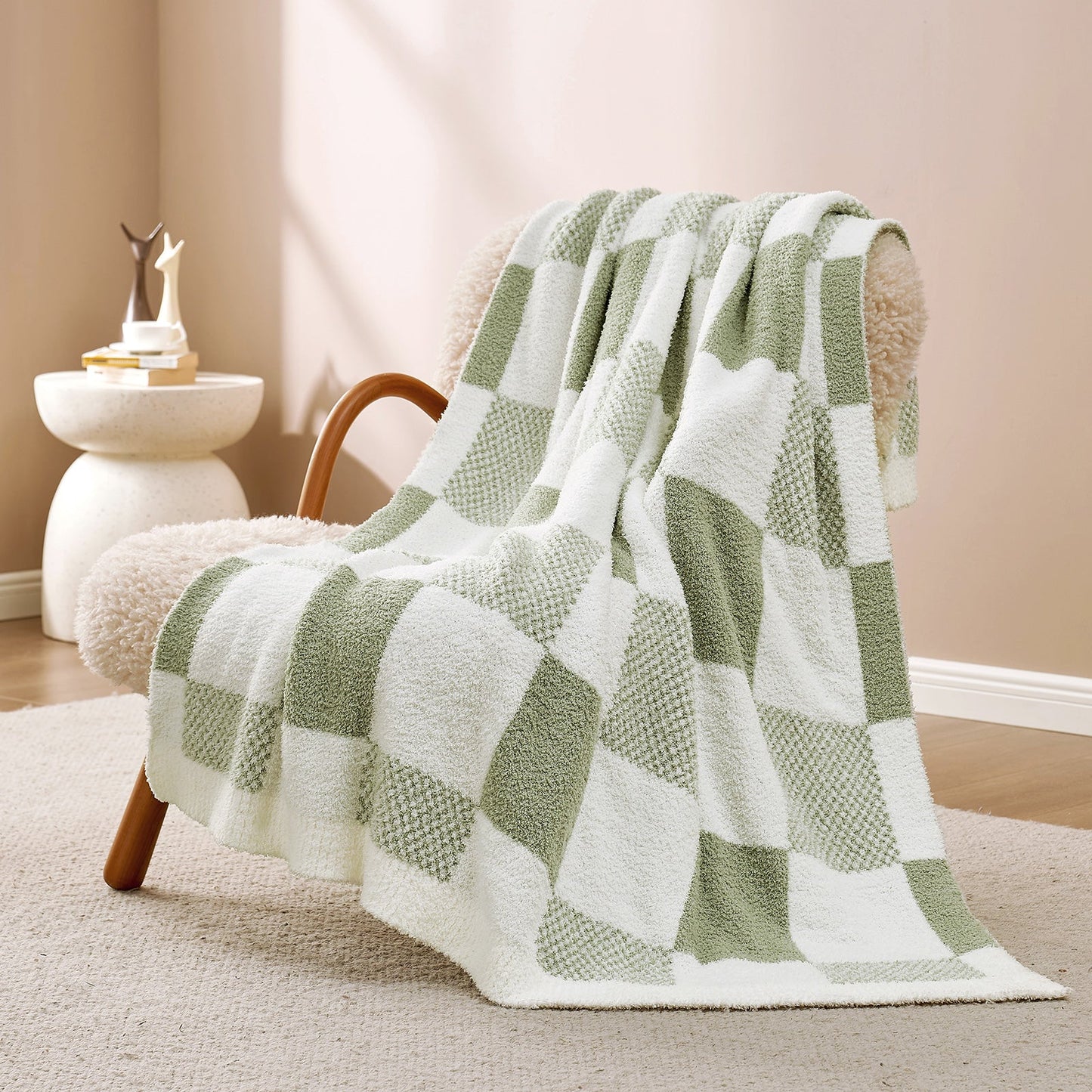 Checkered Feather Yarn Throw Blanket in Sage Green & White front view draped over an armchair, showcasing soft feather yarn texture and checkered pattern design. #color_Sage Green & White