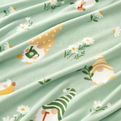 Close up of spring gnomes milkyplush throw blanket in Green, showcasing colorful gnome pattern and smooth plush texture #color_Green
