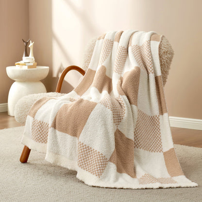Checkered Feather Yarn Throw Blanket in Beige front view draped over an armchair, showcasing soft feather yarn texture and checkered pattern design. #color_Beige