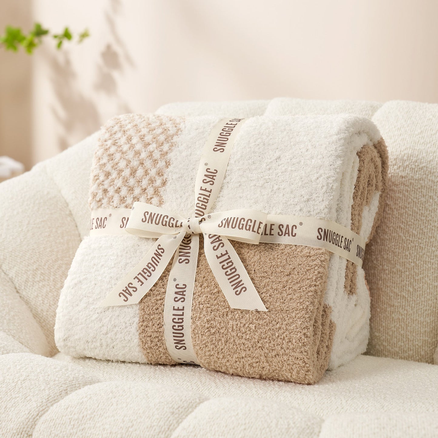 Checkered Feather Yarn Throw Blanket in Beige neatly folded as gift packaging, perfect for holidays and special occasions. #color_Beige