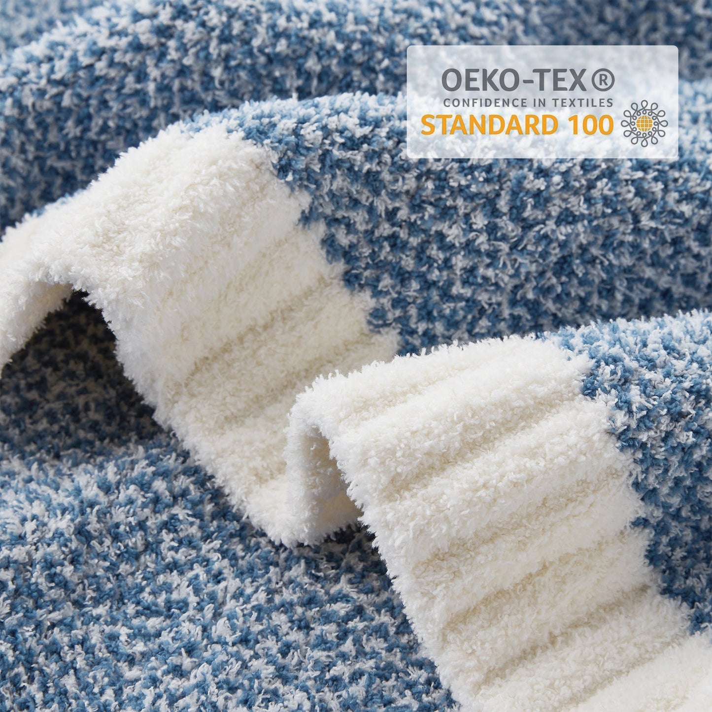 Close-up of Heather Feather Yarn Throw Blanket in Pale Blue showcasing plush texture and OEKO-TEX STANDARD 100 certification. #color_Pale Blue