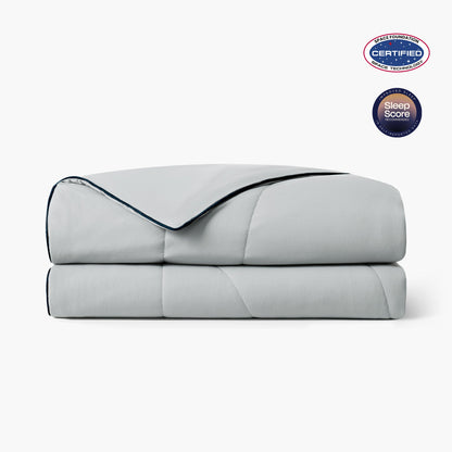 Folded grey cooling comforter with Space Foundation and Sleep Score certification logo on a white background#color_Light Grey