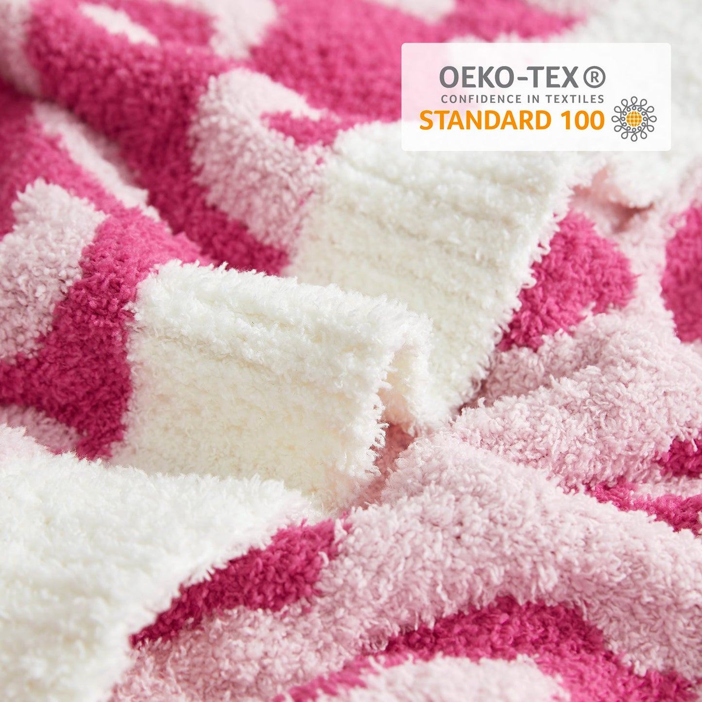 Close-up of Reversible Leopard Feather Yarn Throw Blanket in Hot Pink showcasing soft texture and OEKO-TEX STANDARD 100 certification. #color_Hot Pink