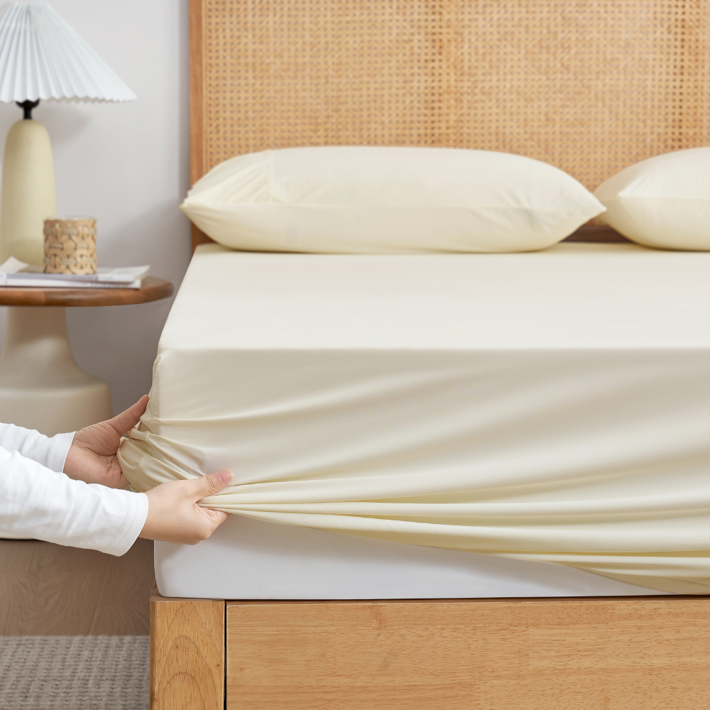 Cozy Bliss Cream-colored cooling fitted sheet set with pillowcases front view. #Color_Cream White